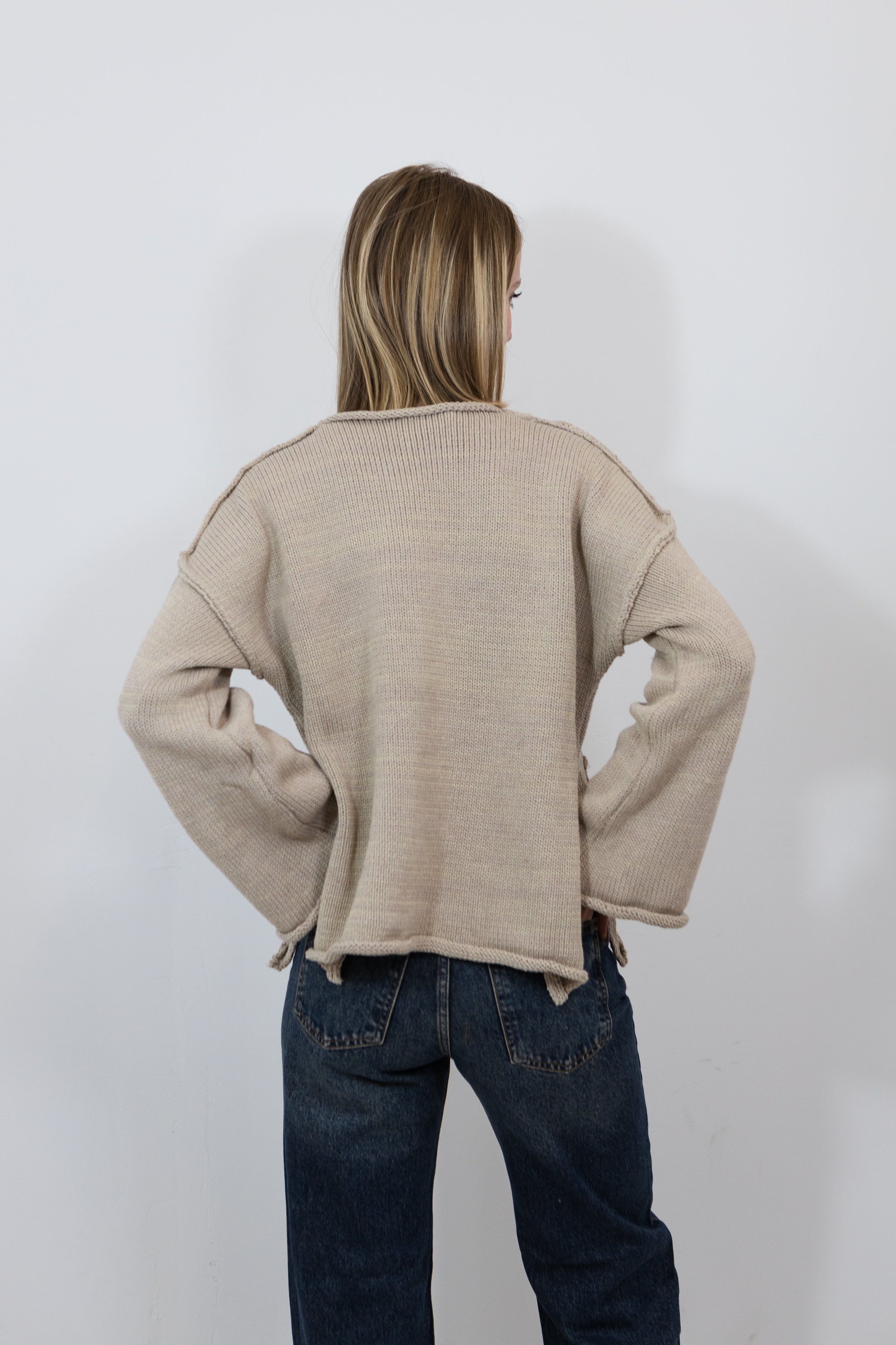 PULL EN MAILLE À POCHES